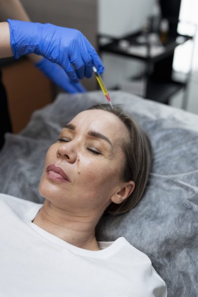 high angle woman getting prp treatment